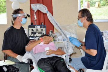 Dr. Hawk working on a patient during a medical mission trip in Colombia